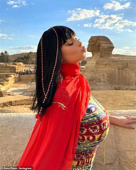 Demi Rose Exhibits Her Curves In A Colourful Skintight Maxi Dress