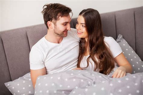 Young Couple In Bed